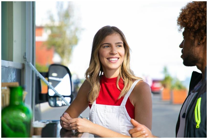 A cheerful young couple enjoying a day out at a fo