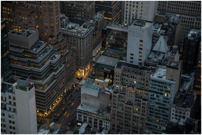 A dramatic aerial view of illuminated skyscrapers