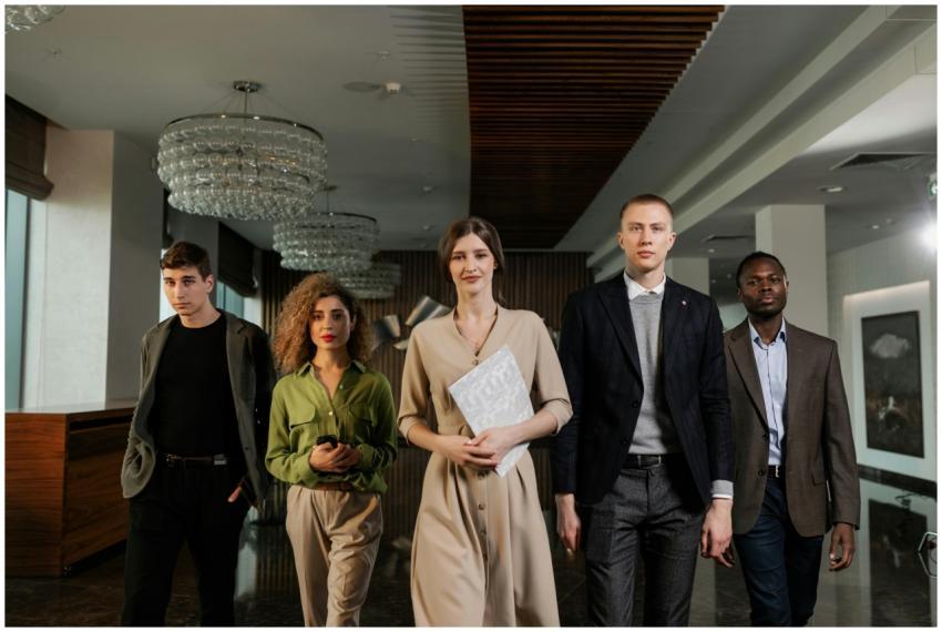 A diverse group of professionals confidently walki