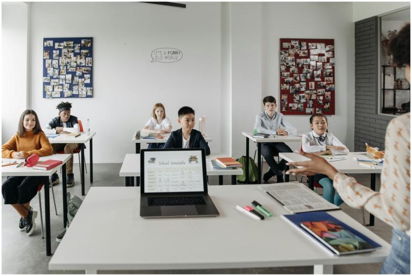 Students in a modern classroom learn with technolo