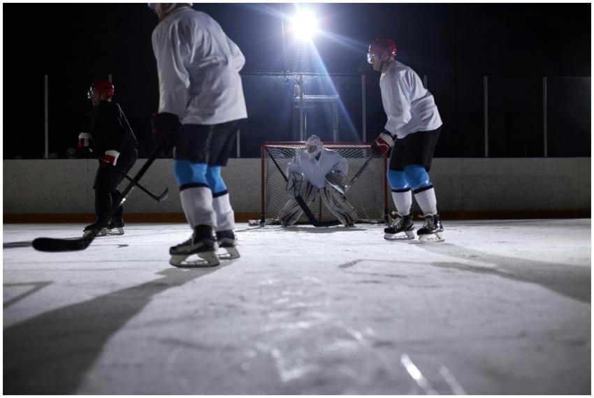 Ice hockey players in action during a night game o