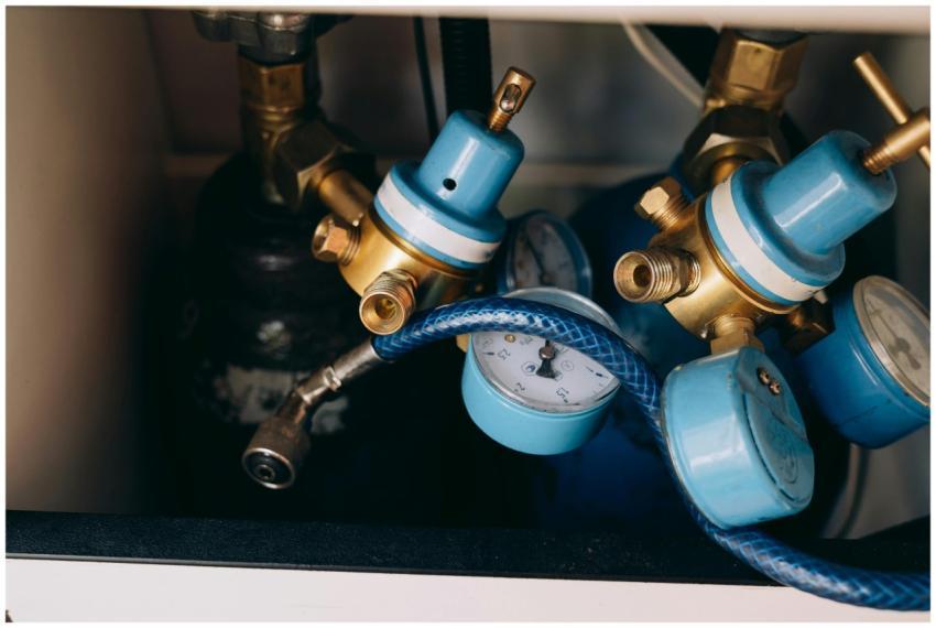 Detailed view of blue and brass gas pressure regul