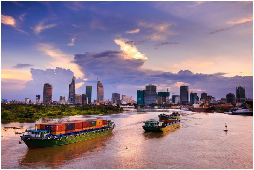 Container ships navigate the scenic Saigon River w