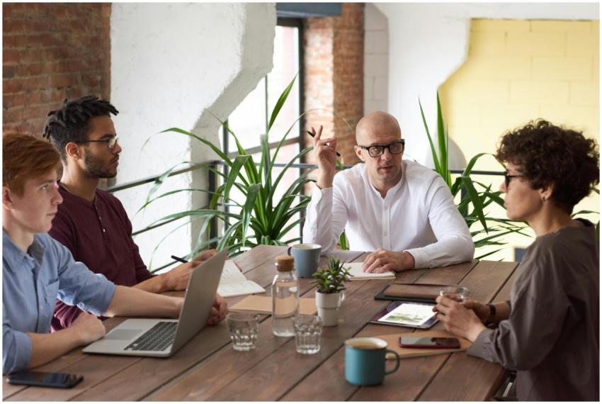 A group of colleagues in a modern office having a