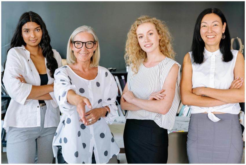 Smiling diverse group of businesswomen, arms cross