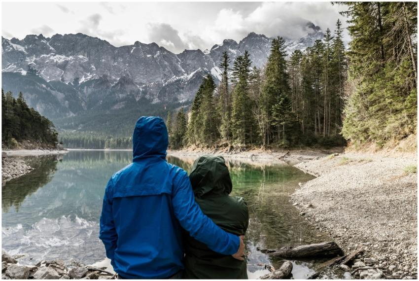 Romantic couple hugging and admiring the view of a