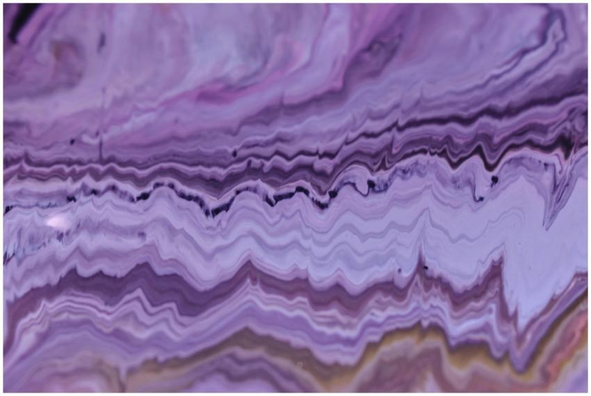 Close-up of abstract purple acrylic paint pattern