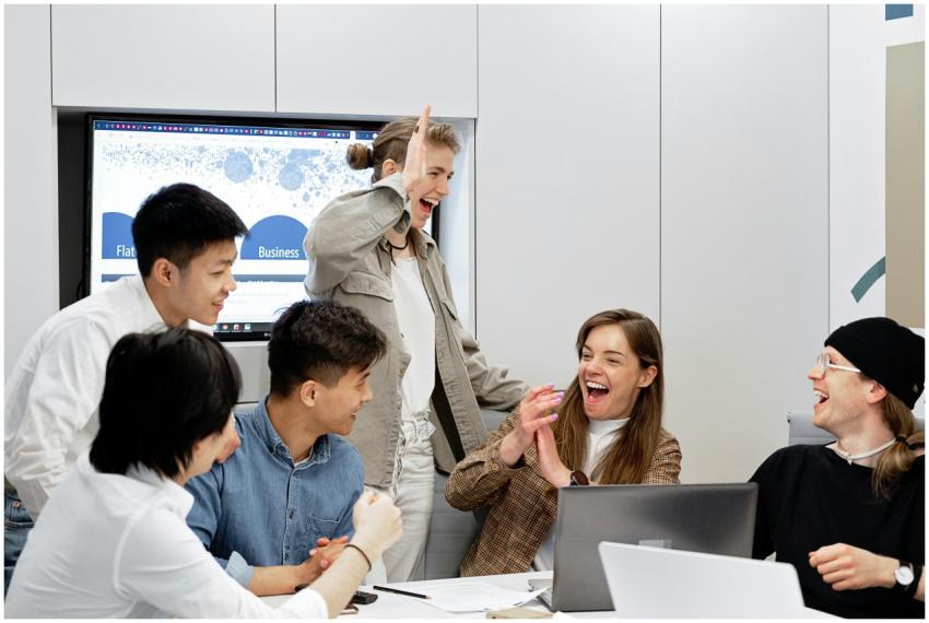 A diverse group of professionals celebrating a suc