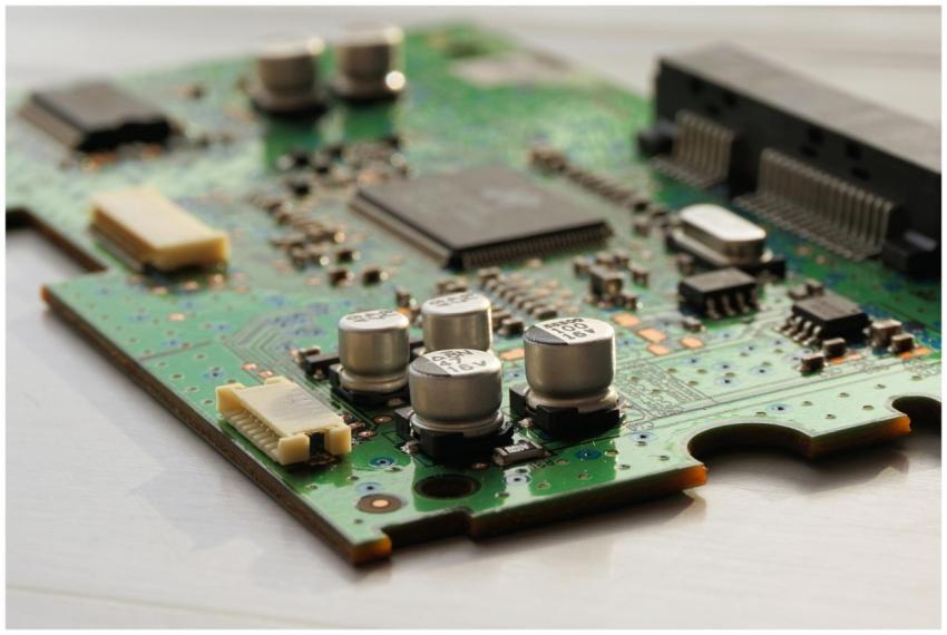 Detailed view of a green circuit board featuring c