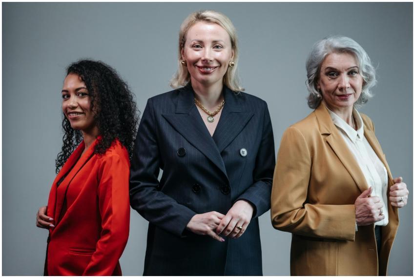 Three confident business women standing in fashion