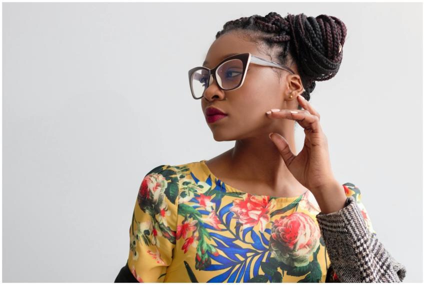 Elegant portrait featuring a woman in glasses with