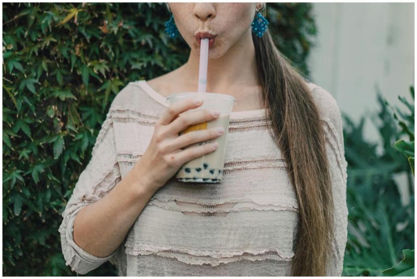 A young woman savoring a delicious bubble tea in a