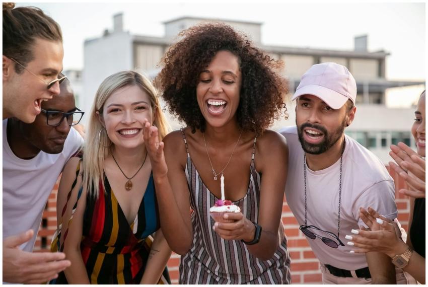 A diverse group of friends celebrating a birthday