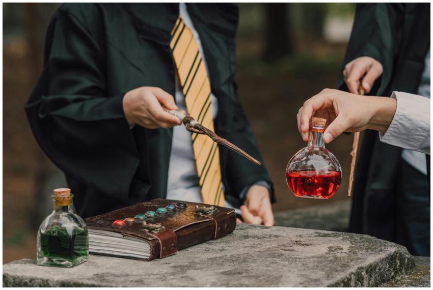 Wizards in robes crafting potions on stone altar w