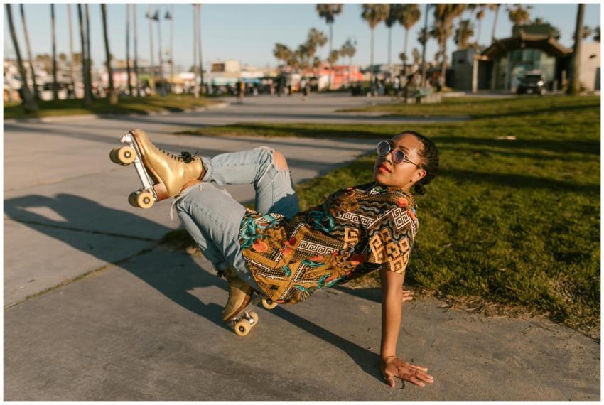Woman roller skating in urban park, showcasing a f