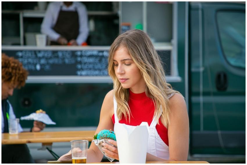 Tranquil woman with blond hair in casual clothes s
