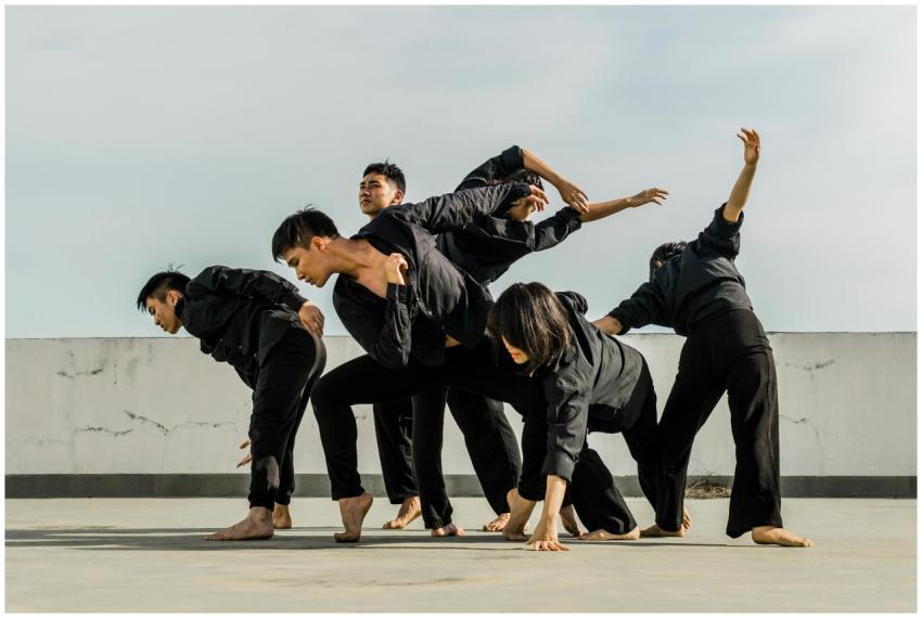 A group of adults performing dynamic contemporary