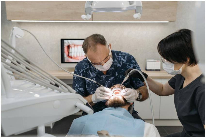 Dentist and assistant performing a dental procedur