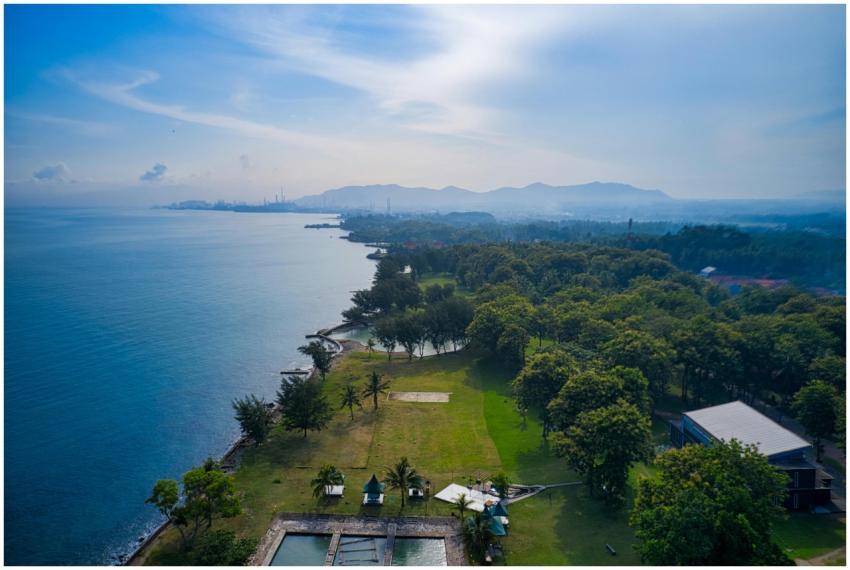 Aerial view of the coastline and lush greenery in