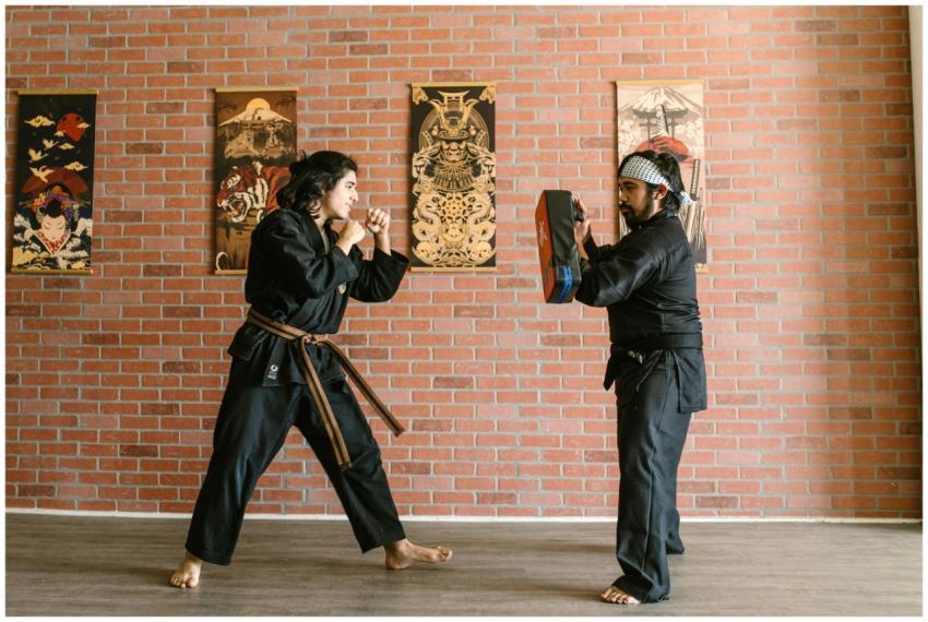 Two martial artists engage in training within a do