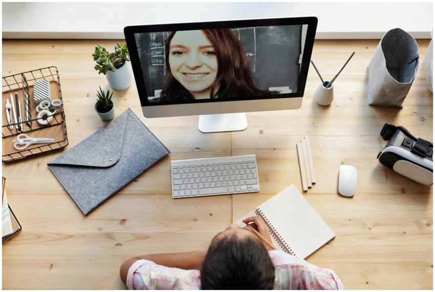 Teenager learning online at home with a tutor on a