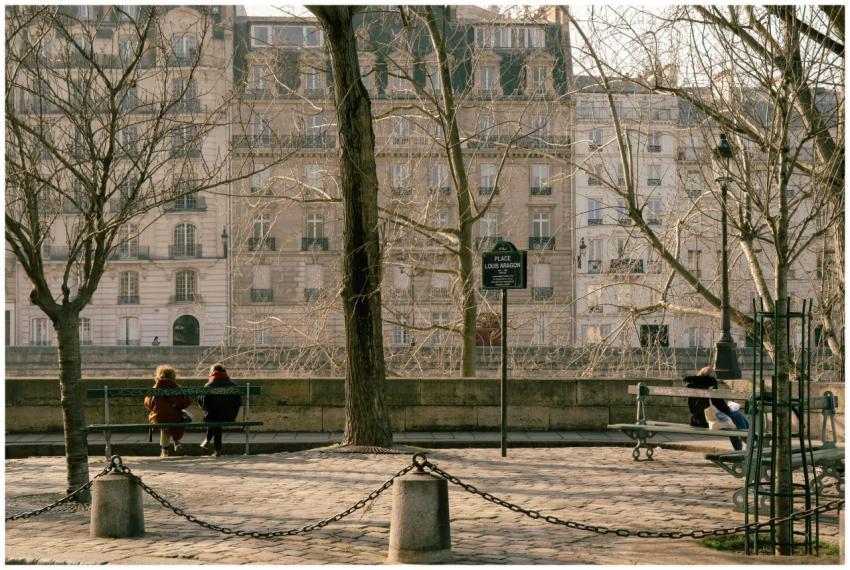 Serene park view in Paris with people relaxing on