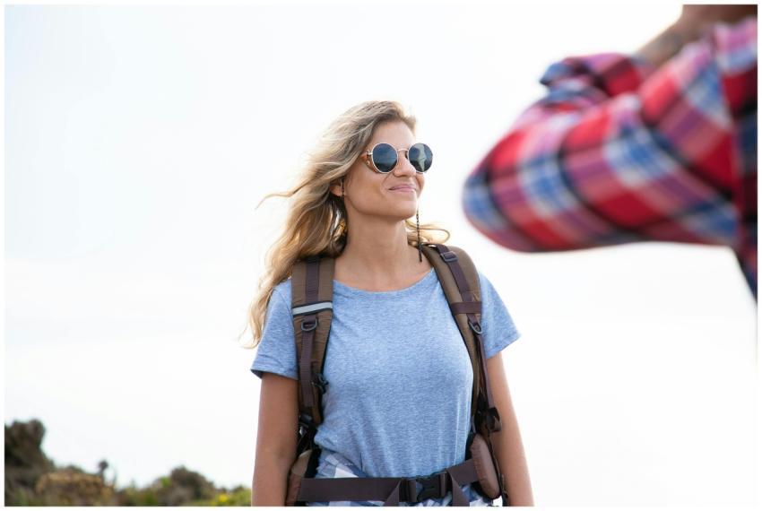 Portrait of a cheerful female backpacker enjoying