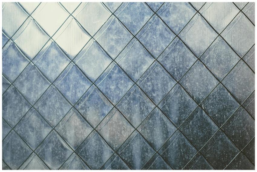 Close-up of a textured metal surface with geometri