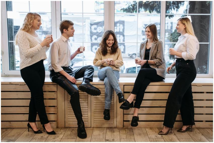 Group of coworkers enjoying a coffee break by the