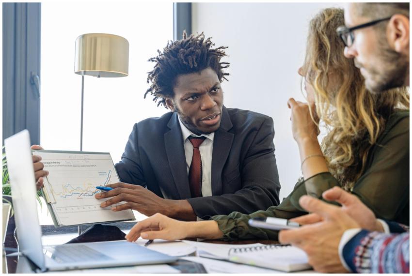 Business professionals discussing financial data d