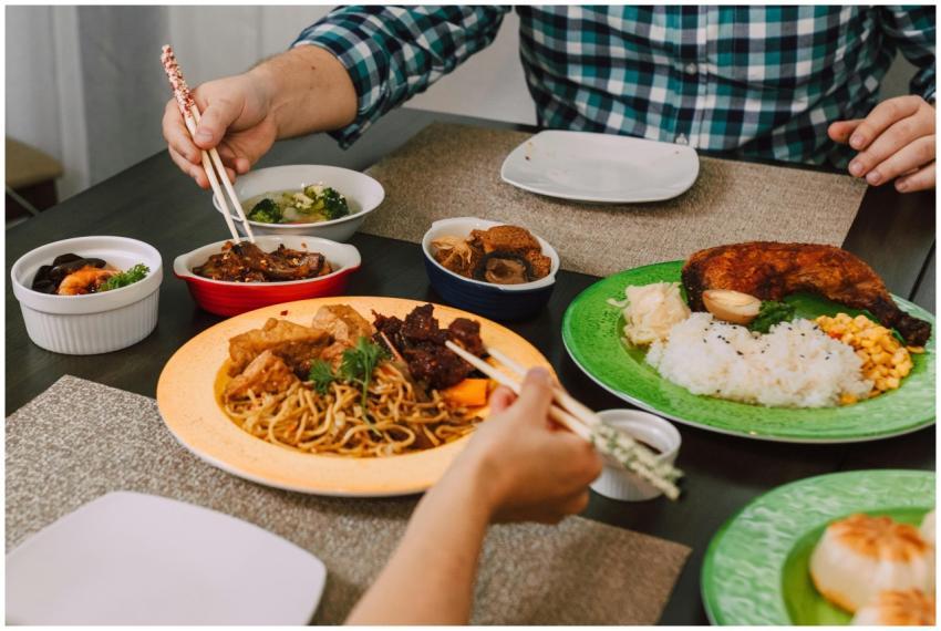 A delicious Asian meal featuring noodles, meats, a