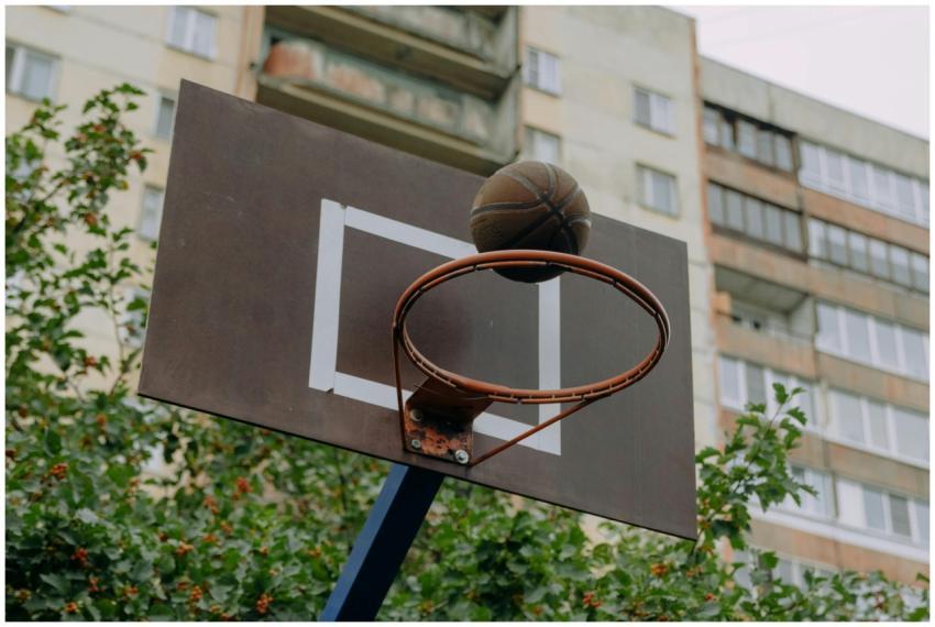 Close-up photo of a basketball hoop with backboard