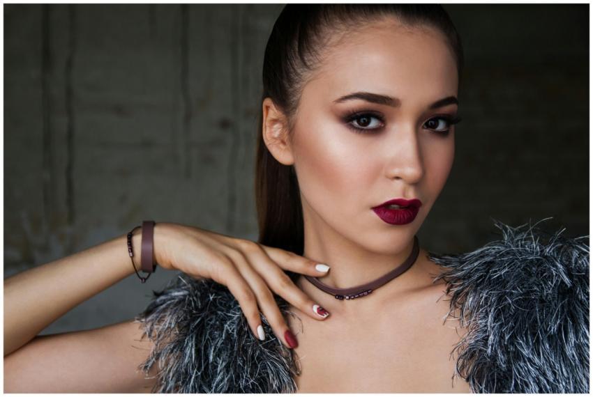 Close-up portrait of an elegant woman with bold ma