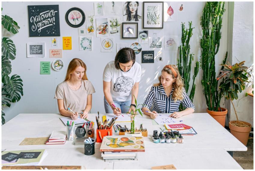 Art class scene with students and instructor worki