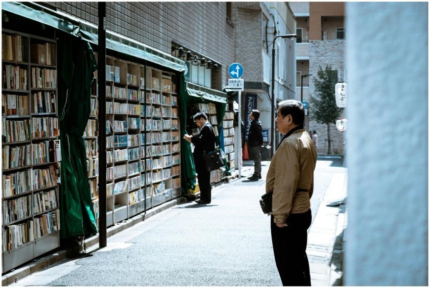A bustling urban street with people browsing outdo