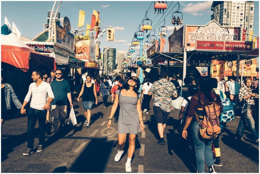 A lively street festival with diverse people enjoy