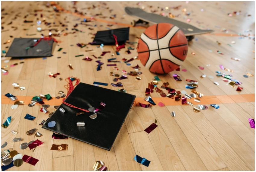 A vibrant scene with graduation caps, a basketball