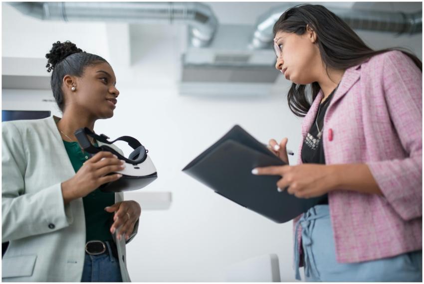 Two diverse young professionals engaged in a discu