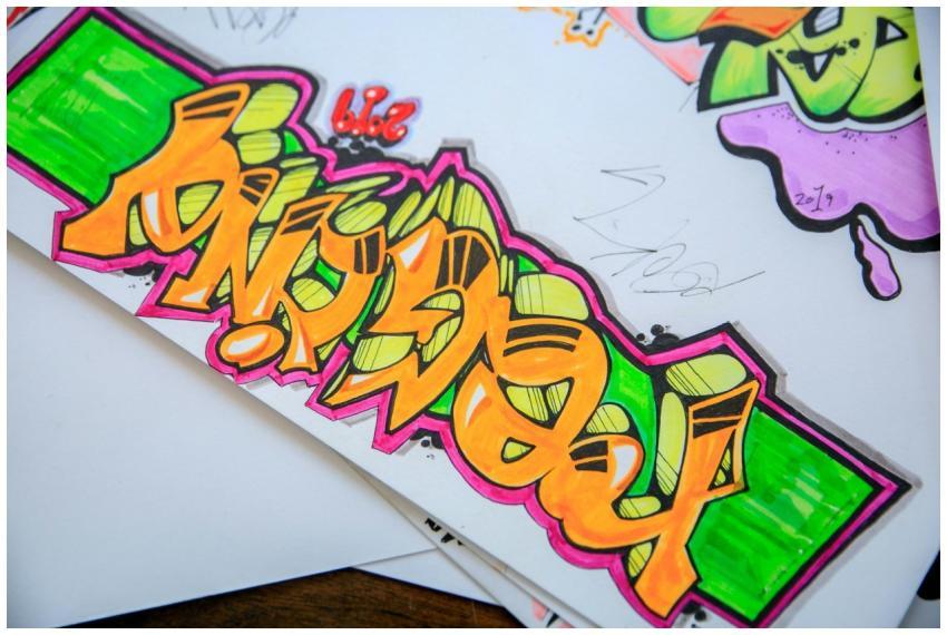 Colorful street art graffiti drawn on paper with v