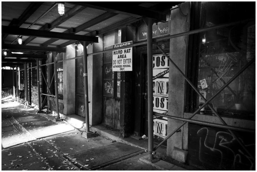 Black and white shot of a construction site passag