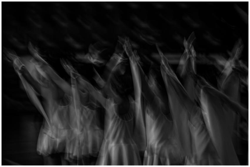 A surreal black and white image capturing ballet d