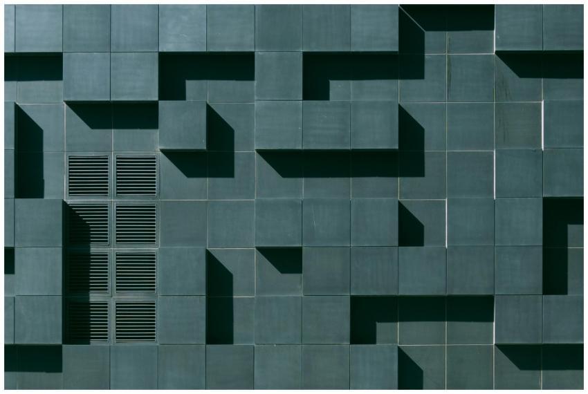 Abstract geometric facade in Oslo with tiles, grid