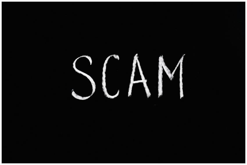 Chalk-drawn text 'SCAM' on black background, repre