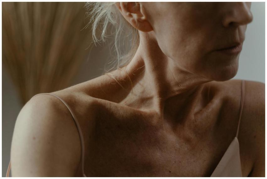 Intimate close-up of an elderly woman's neck and c