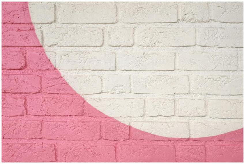 Modern pink and white brick wall with artistic des