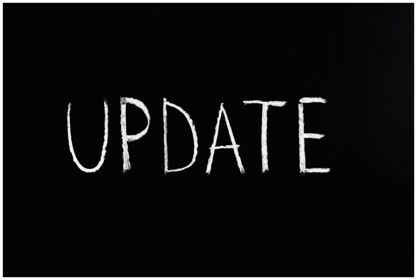 Bold 'UPDATE' text written in chalk on a blackboar