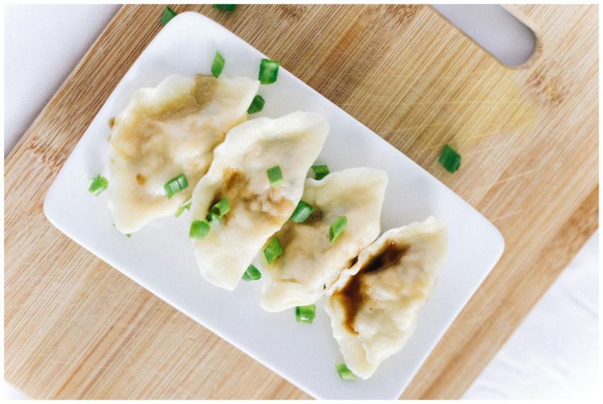 Tasty Chinese dumplings garnished with green onion