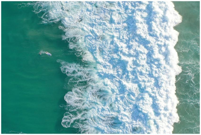 Aerial view of powerful waves crashing on Bondi Be
