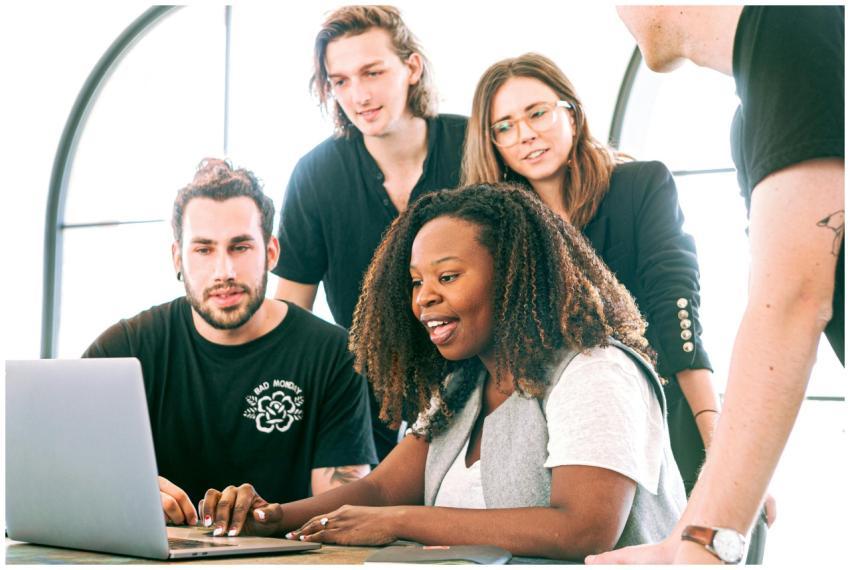 A diverse group of young professionals collaborati