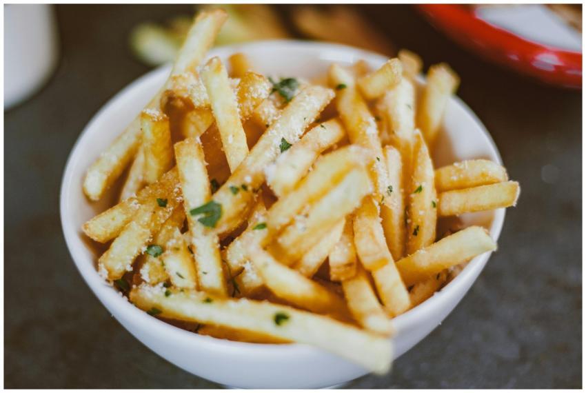 Golden crispy french fries sprinkled with parsley
